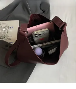 Interior view of burgundy PU leather tote bag showing spacious storage for tablet and items