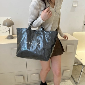 Glossy black waterproof DuPont paper tote bag with white TOTE BAG text print