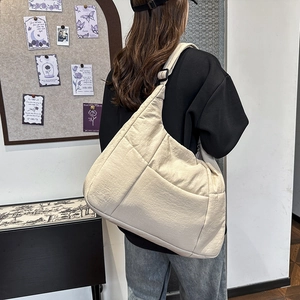 Minimalist large capacity crossbody dumpling bag in cream white with textured fabric