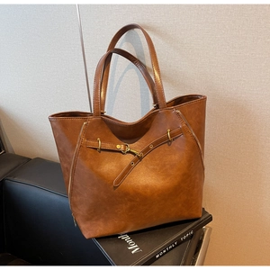 Chic autumn caramel brown PU leather tote bag with vintage metal buckle and side zippers