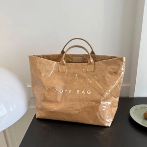 Minimalist brown paper tote bag with waterproof clear layer and white TOTE BAG text print