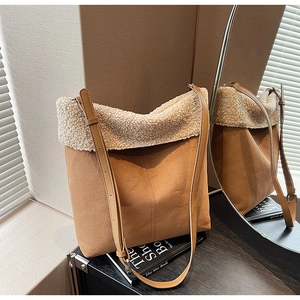 Chic autumn suede shoulder bag with faux shearling trim and adjustable leather strap