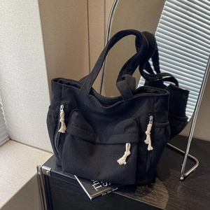 Sac cabas classique en velours côtelé noir avec plusieurs poches et cordons blancs