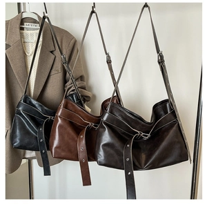 Minimalist faux leather tote bag in black and brown, featuring a large capacity design