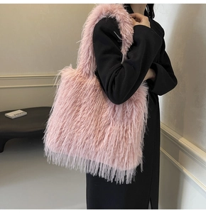Pink faux fur tote bag showing soft plush texture and side view on a model