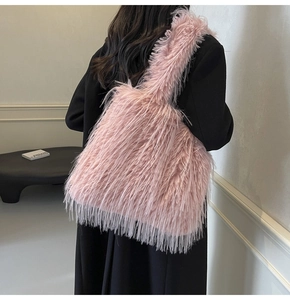 Detailed close-up of a pink faux fur tote bag with soft textures for autumn fashion