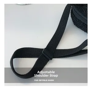 Detail view of the black fleece bag featuring an adjustable nylon shoulder strap