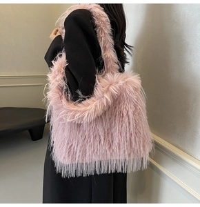 Close-up of stylish pink faux fur tote bag showing soft texture on a shoulder strap