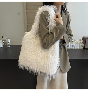 Detail shot of the plush white faux fur tote bag showing soft long-hair texture