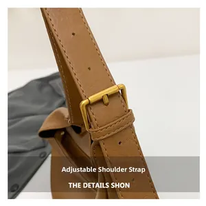 Close-up of adjustable PU leather shoulder strap with vintage gold buckle and stitching