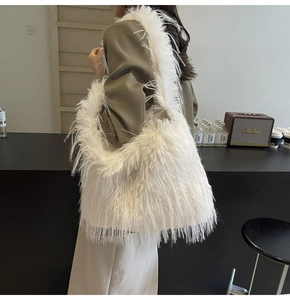 Detail view of a white fluffy faux fur shoulder tote bag with a soft plush texture