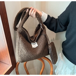 Detail showing plush brown faux fur tote bag and matching mini pouch for women
