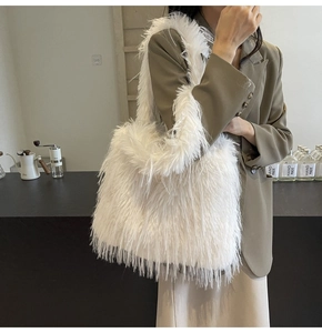 Detail of soft white faux fur texture on this trendy autumn shoulder tote bag for women