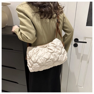 Quilted beige puffer crossbody bag with brown adjustable strap in fashion casual style