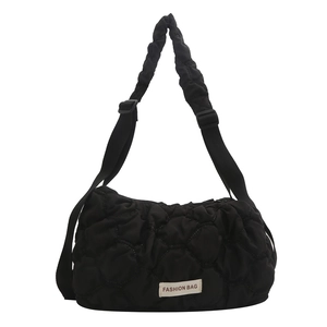Black quilted puffer shoulder bag with pleated straps and fashion label detail