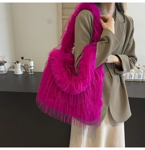 Detailed view of fluffy fuchsia faux fur tote bag showing high-density shaggy texture