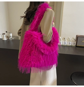 Detail shot of the plush furry texture on the vibrant hot pink shoulder tote bag