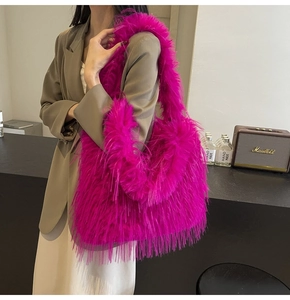 Detail of vibrant purple faux fur shoulder bag styled with an oversized autumn outfit