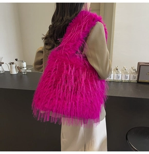 Detail of soft rose red faux fur shoulder bag with long plush texture for women