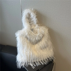 Minimalist white faux fur tote bag for women with fluffy texture in a modern home setting