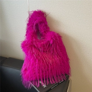 Chic magenta faux fur shoulder bag with long plush fringe for autumn winter outfits