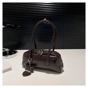Dark brown faux leather shoulder bag with glossy finish and cute heart charms