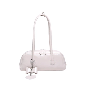 Minimalist cream white patent leather shoulder bag with chic bow and heart charms