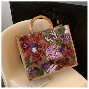 Linen tote bag with bamboo handles and colorful floral sequin embroidery details