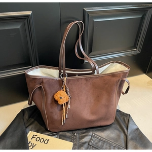 Chic dark brown faux suede tote bag with teddy bear charm and large storage capacity