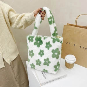 Detail of plush floral tote bag with soft green flower patterns and thick handles