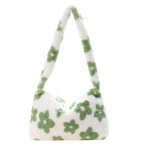 Detailed view of plush white shoulder bag with green floral patterns and soft furry texture