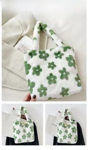 Detail showing plush floral handbag with soft texture and green flower pattern