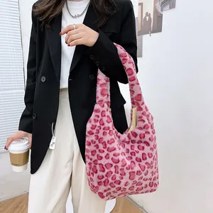 Close-up of pink leopard print plush hobo bag showing soft faux fur texture and large size