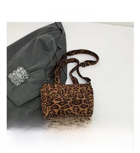Detailed view of leopard print tote bag with thick fabric texture and wide shoulder strap
