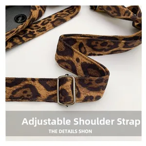 Detail of adjustable leopard print shoulder strap with high-quality silver metal buckle