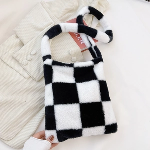 Detail of checkered plush tote bag texture with high-quality faux fur for autumn winter