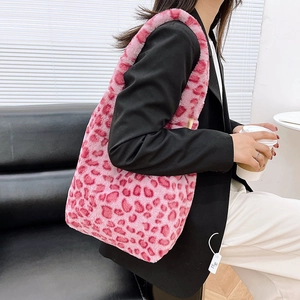 Close-up of pink leopard print faux fur tote bag with soft plush texture and shoulder strap