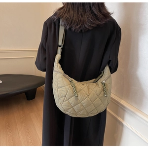Olive green quilted dumpling bag with adjustable wide strap and unique woven zipper puller