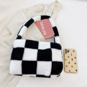 Detailed macro of the black and white checkerboard plush fabric and soft texture