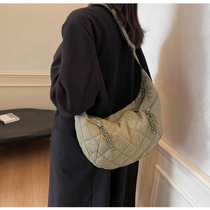 Olive green quilted hobo bag featuring large diamond stitching and a woven cord zipper pull