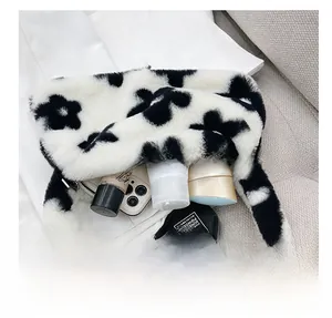Interior view of floral plush shoulder bag showing large capacity for makeup and phone