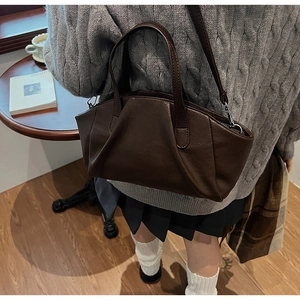 Detail of the vintage dark coffee PU leather crossbody bag with pleated cloud design