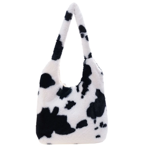 Chic cow print faux fur tote bag with wide shoulder straps for winter fashion style