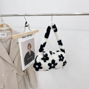 Fluffy plush underarm bag with black floral pattern and soft shoulder strap in white