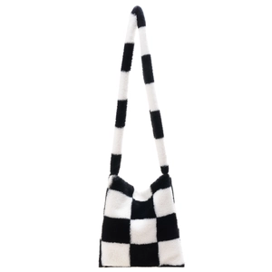 Minimalist black and white checkerboard plush tote bag with cozy faux fur texture