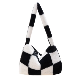 Detail shot of the plush black and white checkerboard texture on this stylish tote bag