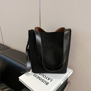 Minimalist black faux suede tote bag for women with brown lining and adjustable strap