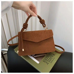 Brown frosted leather mini square bag with dual knotted handles and golden metal rings