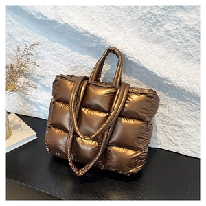 Chic quilted down tote bag in metallic bronze brown with dual shoulder straps and handles