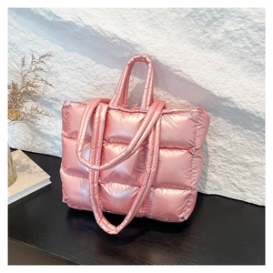 Metallic pink quilted puffer tote bag with large capacity for winter commuting fashion